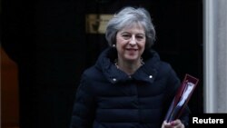 FILE - Britain's Prime Minister Theresa May leaves 10 Downing Street in London, Jan. 18, 2017.