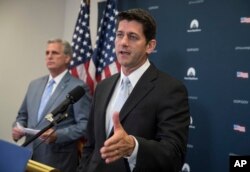 FILE - House Speaker Paul Ryan of Wisconsin, joined by House Majority Leader Kevin McCarthy of California, meets with reporters during a news conference on Capitol Hill in Washington, July 12, 2017.