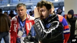 Russia fans after their team's 3-1 loss to Finland during men's quarterfinal hockey, 2014 Winter Olympics, Sochi, Feb. 19, 2014.