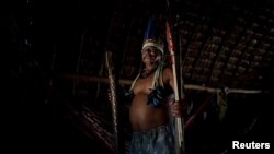 Chief Joao Ponce, head of the Uirapuru indigenous community, poses for a photograph inside his house near the town of Conquista do Oeste, Brazil, April 24, 2018. 