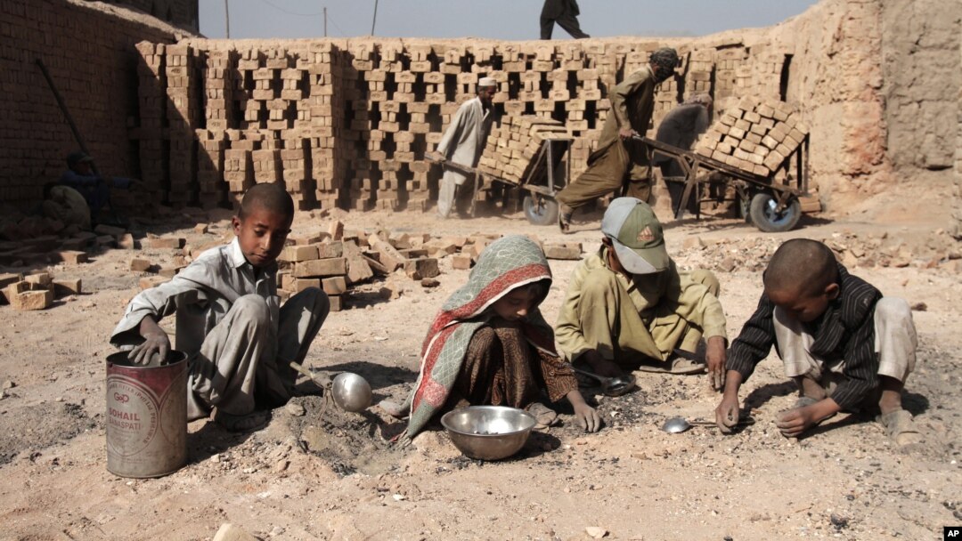 Afghan children work at a local brick factory in Jalalabad, Nangarhar province, Afghanistan, October 8, 2012.
