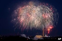 FILE - Fourth of July fireworks explode over the Lincoln Memorial, the Washington Monument and the U.S. Capitol along the National Mall in Washington, July 4, 2020.