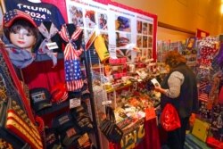 Conservative shirts, hats, ties and other items are displayed for sale at the merchandise show at the Conservative Political Action Conference, Feb. 27, 2021, in Orlando, Fla.