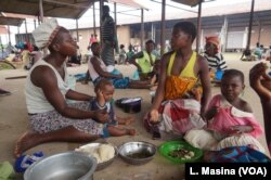 People displaced by flooding are seen at Bangula evucuation camp, in Nsanje, Malawi.