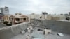 FILE - A damaged roof is seen after a barrage of rockets hit in and near Erbil International Airport in Erbil, Iraq, Feb. 16, 2021.