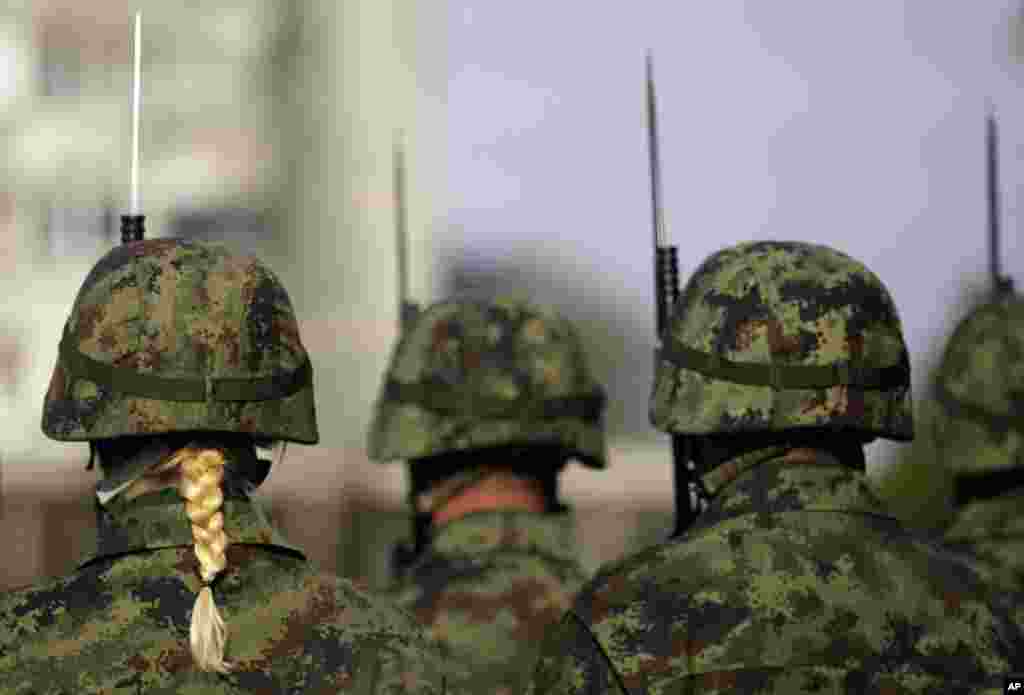 Serbian army soldiers take part in a ceremony marking Armistice Day at the French military cemetery in Belgrade, Serbia. Nov. 11 marks the signing of the truce that ended the fighting in World War I and for remembering the soldiers killed in the war.