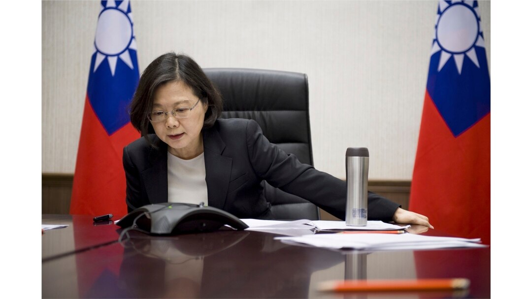 FILE - In this Dec. 2, 2016 photo released by Taiwan Presidential Office, Dec. 3, 2016, Taiwan's President Tsai Ing-wen speaks with U.S. President-elect Donald Trump through a speaker phone in Taipei, Taiwan.