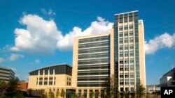 This Sept. 9, 2005, photo provided by the Centers for Disease Control and Prevention shows the then newly constructed 11-story Emerging Infectious Diseases Laboratory at the CDC's Roybal campus in Atlanta. 