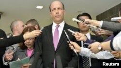 U.S. Ambassador to Japan John Roos (C) delivers a statement after a meeting with Japan's Senior Vice Foreign Minister Shuji Kira (not in picture) at the Foreign Ministry in Tokyo, in this photo by Kyodo October 17, 2012. 