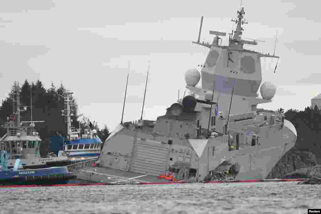 The Norwegian frigate &quot;KNM Helge Ingstad&quot; takes on water after a collision with the tanker &quot;Sola TS&quot; in Oygarden.