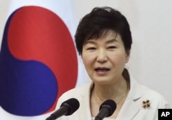 FILE - South Korean President Park Geun-hye speaks during a luncheon meeting with members of charity groups at presidential house in Seoul, South Korea.