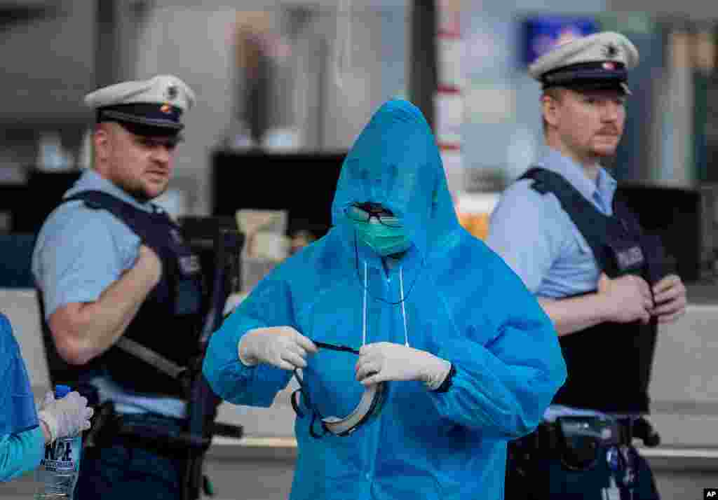 A Chinese tourist prepares for his flight to China at the airport in Frankfurt, Germany.