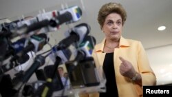 President Dilma Rousseff addresses a news conference after visiting the new Embraer KC 390 military transport aircraft in Brasilia, Brazil, April 5, 2016. 