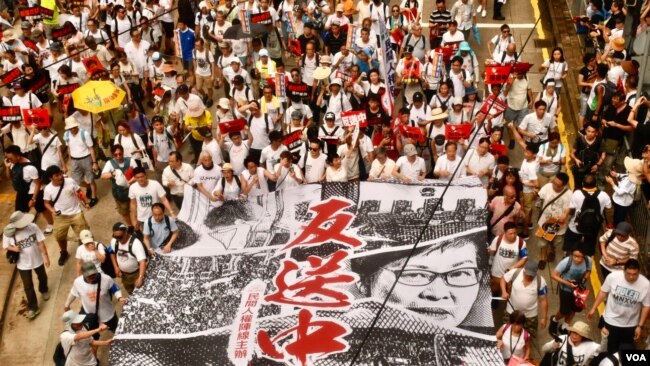 香港民阵组织的2019年6月9日“反送中”大遊行，主办者估计香港有103万人参加。(美國之音湯惠芸拍攝)