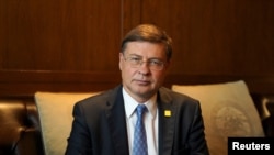 FILE - European Commission Executive Vice President Valdis Dombrovskis poses for a picture during an interview with Reuters in Shanghai, China, Sept. 23, 2023. 