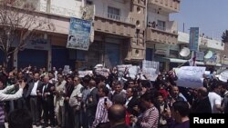 Demonstrators of Kurd origin march after Friday prayers in Qamishli, Syria, April 15, 2011.