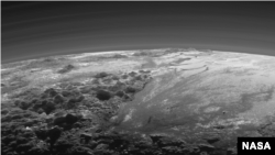 FILE - An image of Pluto's surface captured by NASA’s New Horizons spacecraft. The new thinking about volcanoes raises questions about how the tiny, distant world has been so geologically active.