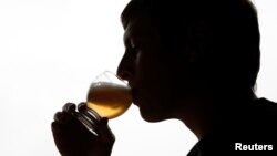 Arnaud Laloy, member of the Belgian Homebrewers association, tastes his own beer as he starts brewing in the garage of his house in Neufchateau, Belgium, Aug. 11, 2016.