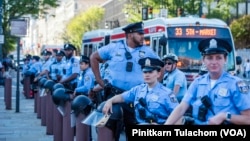 Police officers stand guard near the National Constitution Center in Philadelphia, Pennsylvania, ahead of the debate between Donald Trump and Democratic presidential nominee and U.S. Vice President Kamala Harris.