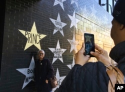 Chasity Spearman of Minneapolis takes a picture of her aunt, Ethel Smith, of Toledo, Ohio, outside First Avenue nightclub, April 21, 2017, in Minneapolis.