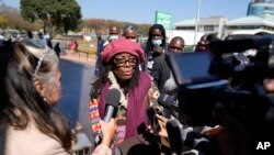 Zimbabwean writer Tsitsi Dangarembga talks to the press after her court appearance in Harare, September 29, 2022.