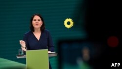 FILE - Co-leader of Germany's Green Party Annalena Baerbock gives a speech during a digital announcement event on the party's federal election campaign and Baerbock's race for for chancellor, at a malt factory in Berlin, Germany, April 19, 2021. 