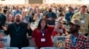 FILE - Attendees sing during a worship service at the Southern Baptist Convention's annual meeting in Anaheim, California, on June 14, 2022. Thousands will gather in Indianapolis, June 11-12, 2024, for this year's meeting.