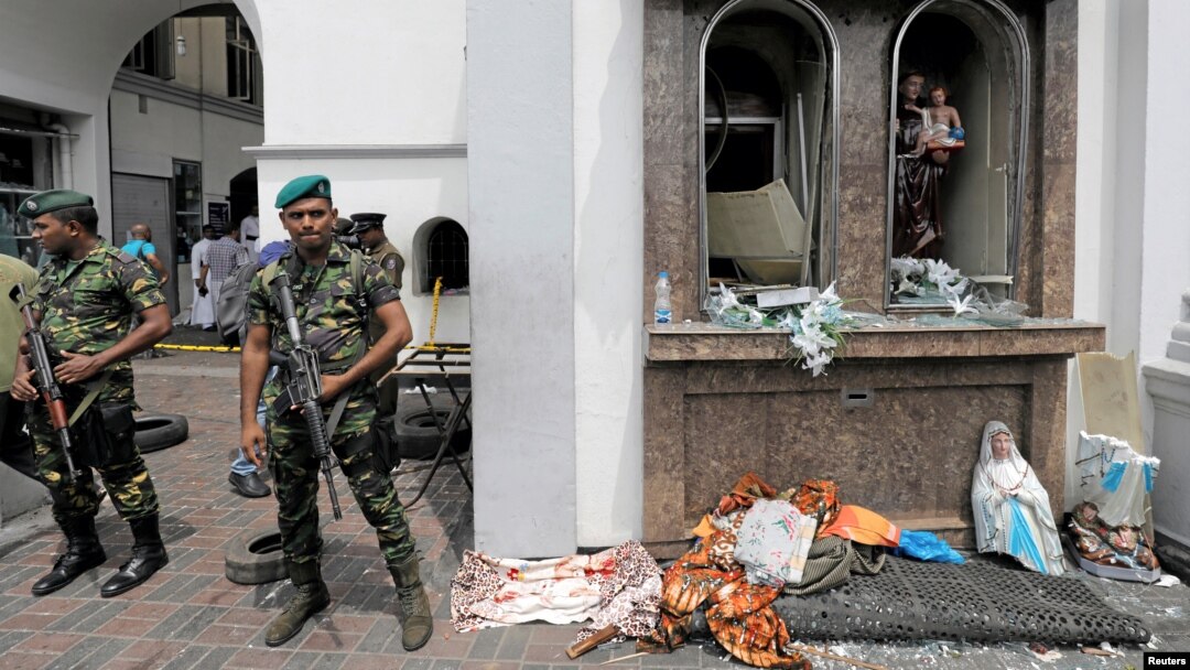 Sri Lankan military officials stand guard in front of the St. Anthony's Shrine, Kochchikade church after an explosion in Colombo, Sri Lanka, April 21, 2019. 