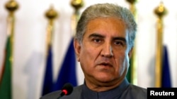 FILE - Pakistan's new Foreign Minister Shah Mehmood Qureshi listens during a news conference at the Foreign Ministry in Islamabad, Pakistan, Aug. 20, 2018. 