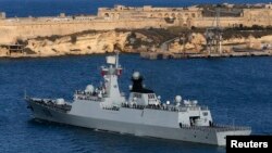The Chinese Navy frigate Huangshan leaves Valletta's Grand Harbour March 30, 2013, after concluding an anti-piracy mission in the Gulf of Aden, providing security escort to civilian and commercial vessels.