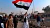 Iraqi Officials: At Least 13 Wounded in Baghdad Violence