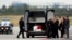 Family members mourn by a coffin with the remains of Cpl. Patrik Stepanek during a ceremony at the Prague's Vaclav Havel Airport, Czech Republic, Aug. 8, 2018. Stepanek was one of three Czech soldiers killed while on a foot patrol as part of NATO forces in eastern Afghanistan Sunday.
