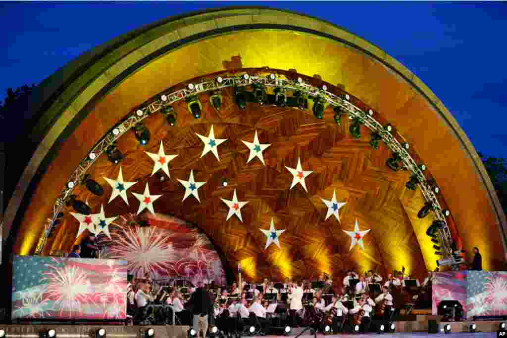 The Boston Pops Orchestra performs during rehearsal for their Fourth of July concert at the Hatch Shell on the Esplanade in Boston, July 3, 2012. 