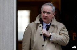 British Attorney General Geoffrey Cox leaves after a cabinet meeting at Downing Street in London, Jan. 29, 2019.