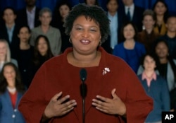 In this pool image from video, Stacey Abrams delivers the Democratic party's response to President Donald Trump's State of the Union address, Feb. 5, 2019 from Atlanta.