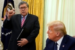 President Donald Trump listens as Attorney General William Barr speaks before Trump signs an executive order in the Oval Office of the White House, May 28, 2020.
