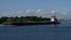 A barge travels through the Houston Ship Channel, part of the Port of Houston, in Pasadena, Texas, May 5, 2019. 