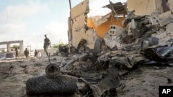 FILE - Somali soldier on site of car bomb attack in the capital, Mogadishu, June 21, 2015.