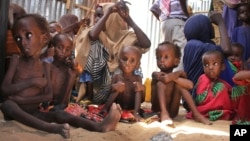 FILE - Malnourished and displaced Somali children sit in a tent in their camp on the outskirts of Mogadishu, Somalia, May 25, 2017.