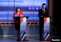 Republican candidate Karen Handel, left, and Democratic candidate Jon Ossoff prepare for Georgia's 6th Congressional District special election debate at WSB-TV studios in Atlanta, Ga., June 6, 2017.