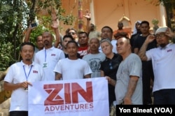 Deportees visit Wat Ampe Phnom, a temple used by the Khmer Rouge as a prison, with the ZIN tour company in Cambodia.