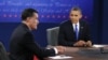 President Barack Obama listens as Republican presidential nominee Mitt Romney speaks during the third presidential debate at Lynn University, in Boca Raton, Florida, October 22, 2012. 