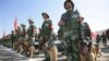 牵着警犬的中国边防部队在新疆集结待命。（资料照）