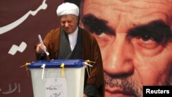 Former Iranian president Ali Akbar Hashemi Rafsanjani is seen casting his ballot in parliamentary elections in Tehran in this March 2, 2012, file photo.