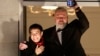 FILE - Nobel Peace Prize laureates Maria Ressa of the Philippines, left, and Dmitry Muratov of Russia wave from the balcony of the Grand Hotel in Oslo, Dec. 10, 2021.