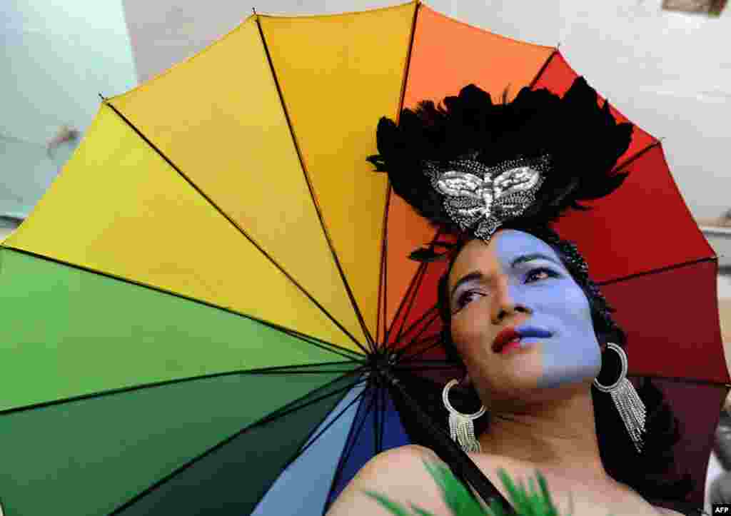 Members of the LGBT community participate in Nepal's Gay Pride parade in Kathmandu. Scores of gays, lesbians, transvestites and transsexuals from across the country took part in the rally to spread their campaign for sexual rights in the country.