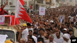 Thousands chant anti-government slogans as they march during a funeral procession for Sayed Hameed Mahfoodh, 61, in the western Shiite Muslim village of Saar, Bahrain, April 6, 2011