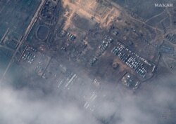 This satellite image released by Maxar Technologies on Dec. 23, 2021, reportedly shows Russian ground forces deployed at the Opuk training area on Dec. 22, 2021. (Photo by Handout/Satellite image ©2021 Maxar Technologies / AFP)