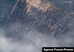 This satellite image released by Maxar Technologies on Dec. 23, 2021, reportedly shows Russian ground forces deployed at the Opuk training area on Dec. 22, 2021. (Photo by Handout/Satellite image ©2021 Maxar Technologies / AFP)