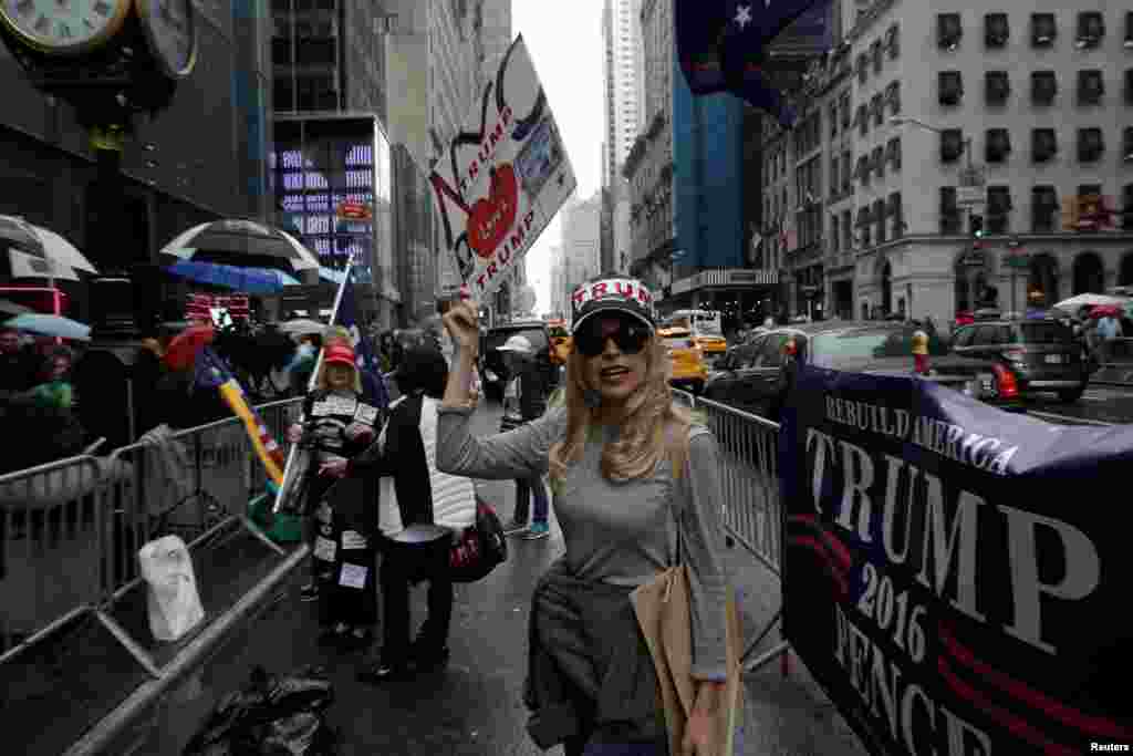 A supporter of Republican presidential nominee Donald Trump stands outside Trump Tower where Trump lives.